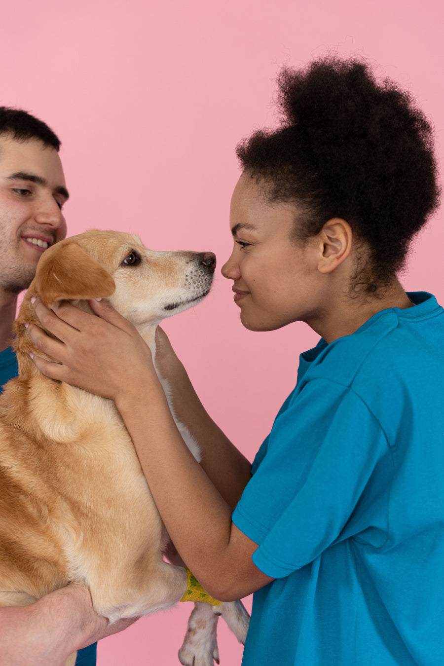 A pet parent with their dog at home